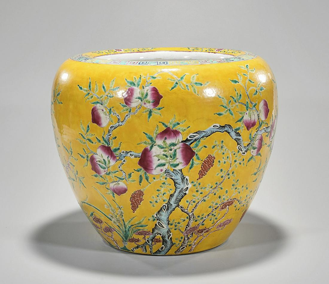 Chinese Enameled Porcelain Water Pot: Chinese enameled porcelain water pot; yellow glaze with floral and fruit decoration; 15" x 17" (approx.) Condition: wear, frits, pits, minor loss