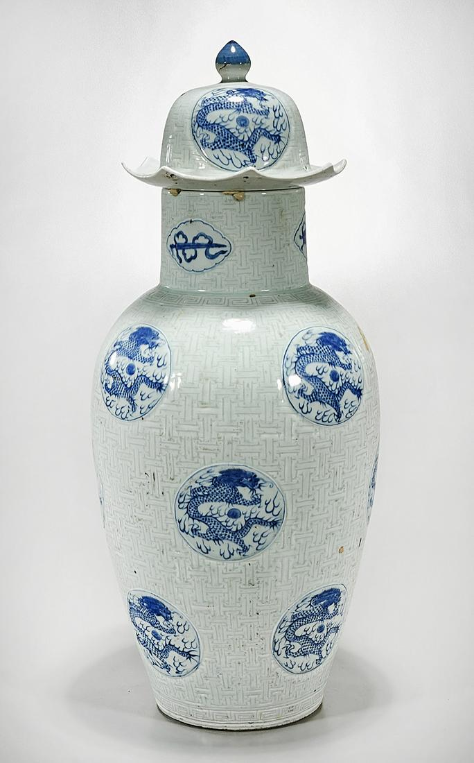 Chinese Blue and Green Porcelain Covered Vase: Chinese blue and green glazed porcelain covered vase; with dragons chasing pearls motifs; 25 1/2" x 10" (approx.) Condition: wear, frits, pits, minor losses