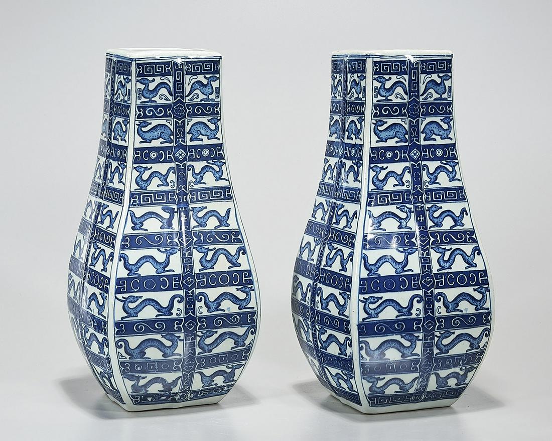 Pair Chinese Blue and White Porcelain Four-Faceted: Pair of Chinese blue and white porcelain four-faceted vases; each with repeating chilong patterns; each with mark to base; 14 1/2" x 6" sq. (each, approx.) Condition: wear, frits, pits, minor loss