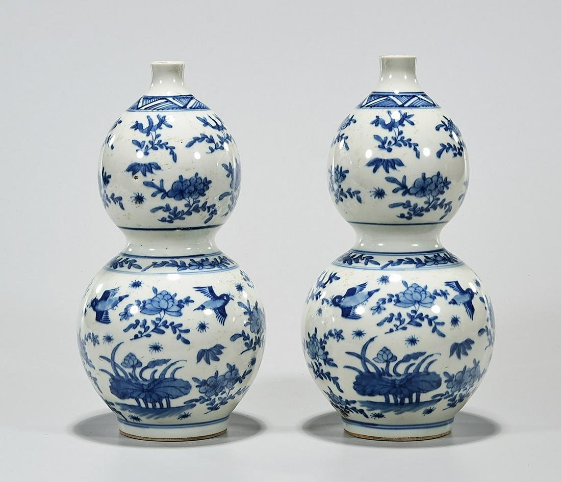 Pair Chinese Blue and White Porcelain Double Gourd: Pair of Chinese blue and white porcelain double gourd vases; with bird and flower decoration; 10" x 5" (each, approx.) Condition: wear, frits, pits, minor loss
