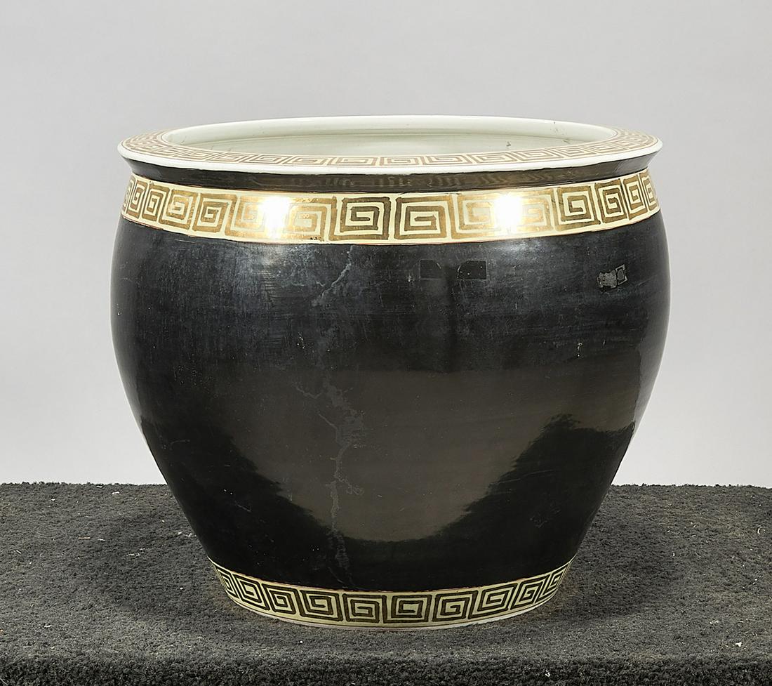 Chinese Black Glazed Porcelain Fish Bowl: Chinese black glazed porcelain fish bowl; with gilt key pattern design and interior fish decoration; 14" x 17" (approx.) Condition: wear, frits, pits, minor loss
