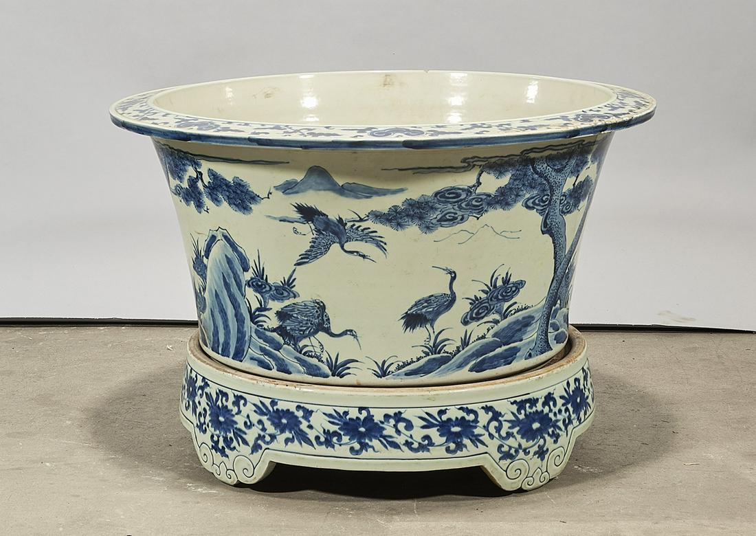 Chinese Blue and White Porcelain Jardiniere: Chinese blue and white porcelain jardiniere; depicting birds and landscapes; with base; 11" x 23 1/2" (approx.) Condition: wear, frits, pits, minor loss