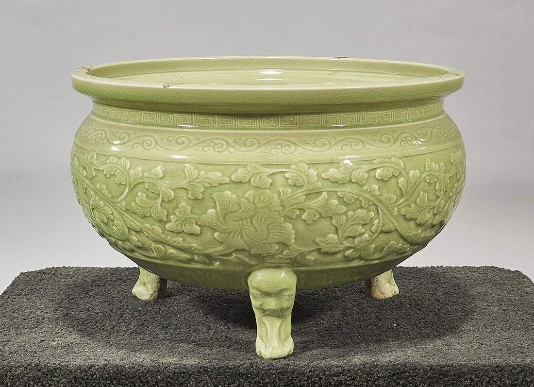 Chinese Celadon Glazed Porcelain Tripod Censer: Chinese celadon glazed porcelain tripod censer; of floral design; 13" x 22" (approx.) Condition: wear, frits, pits, minor losses