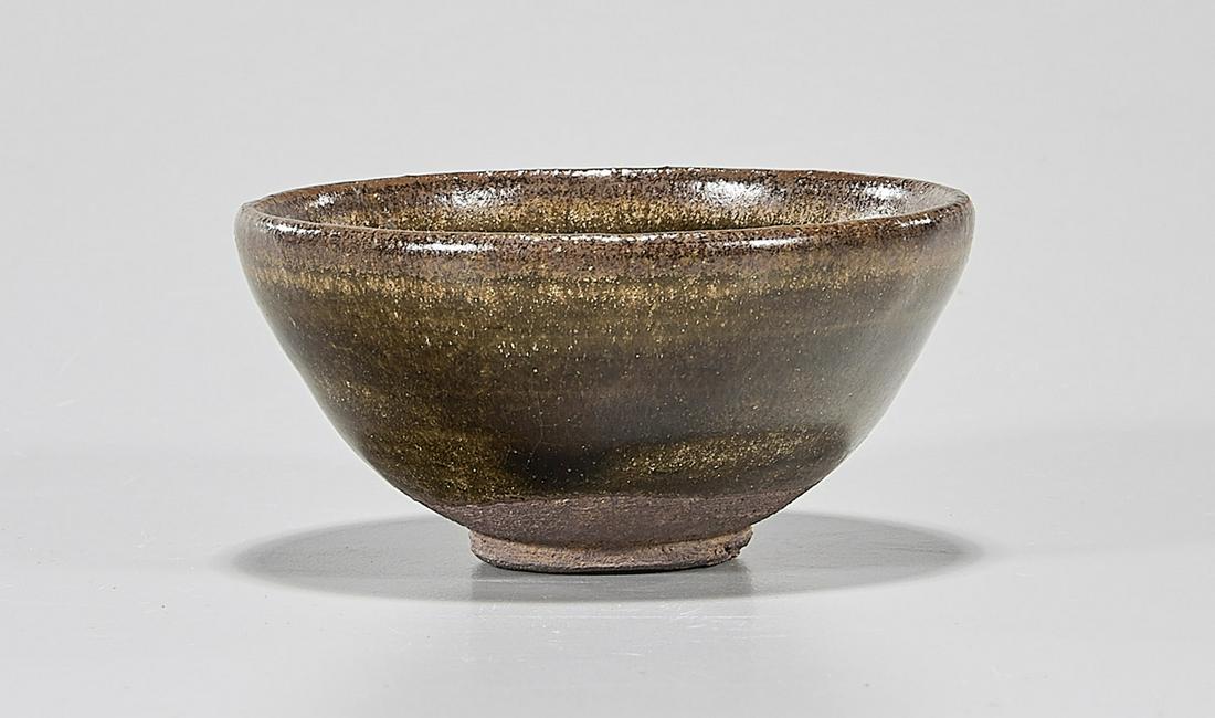 Chinese Brown Glazed Ceramic Tea Bowl: Chinese brown glazed ceramic tea bowl; D: 3 1/4" (approx.) Condition: wear