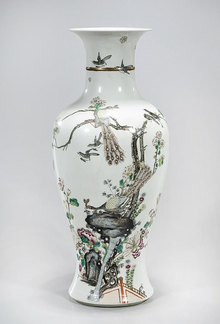 Chinese Enameled Porcelain Vase: Chinese enameled porcelain vase with peacocks and birds design; 20" x 8" (approx.) Condition: general wear, frits, pits, minor losses