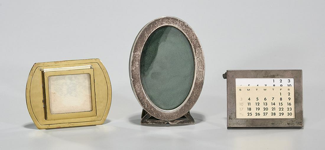 Group of Small Vintage Designer Frames: Three frames, including one gold plate Tiffany Studios with hallmark, one Tiffany & Co. marked "Tiffany & Co. Makers Sterling" and one oval framed marked "Sterling 925 1000 FINE 1499" with a unicorn h