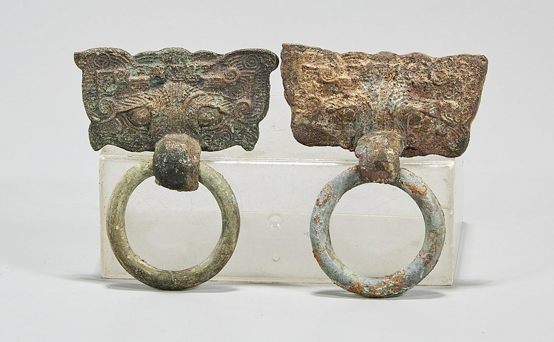 Two Chinese Archaistic Bronze Handle Remnants: Two Chinese archaistic bronze handle remnants; each of beast face-form; 2 1/4" x 3" (each, approx.)