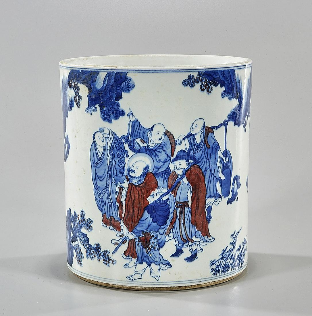 Chinese Red, Blue and White Porcelain Brush Pot: Chinese red, blue and white porcelain brush pot; with various figures in a landscape setting; 8 1/2" x 7 1/2" (approx.) Condition: firing cracks