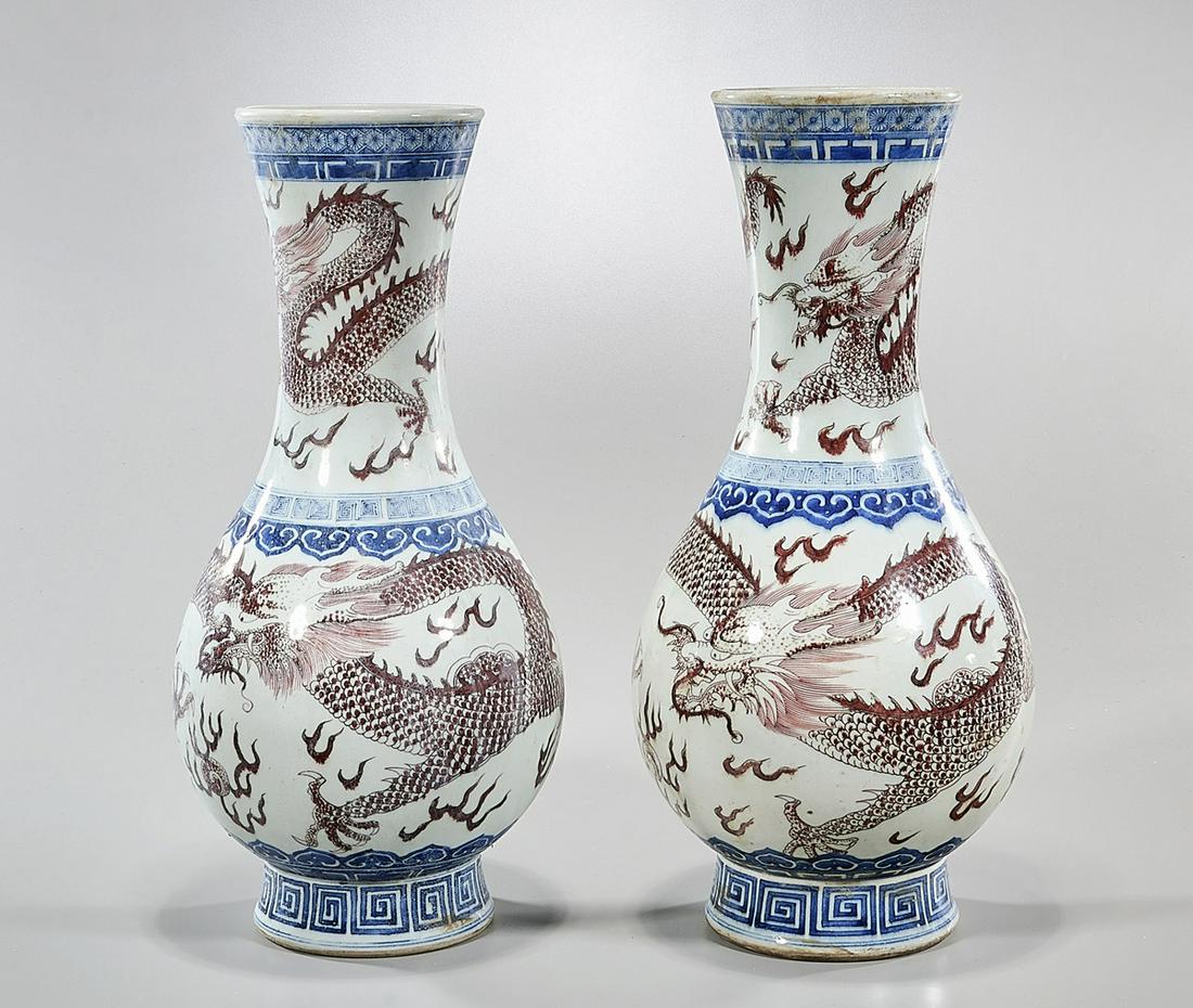 Pair of Chinese Red, Blue and White Porcelain Dragon: Pair of Chinese red, blue and white porcelain dragon vases; six character mark to bases, but later; 18" x 9" (each, approx.)