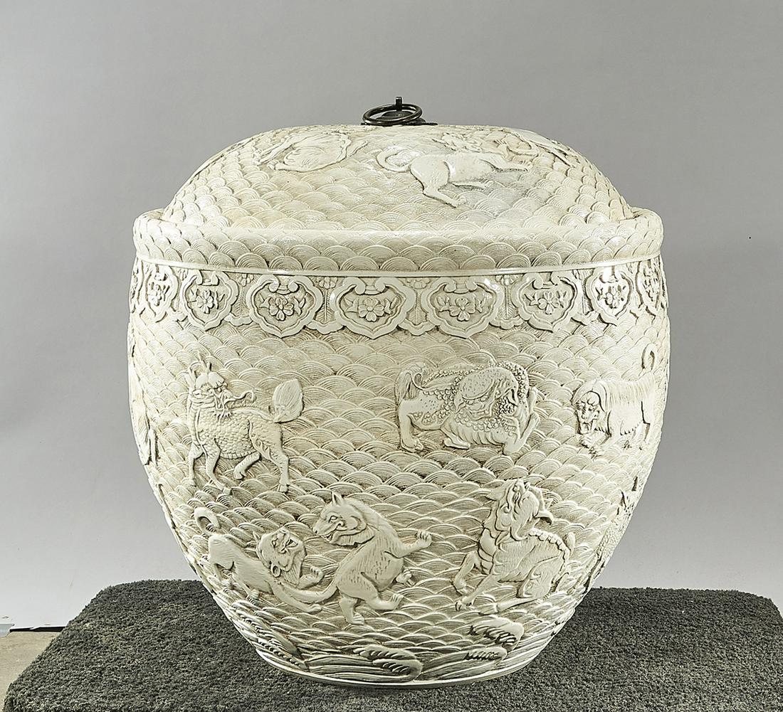 Large Chinese White Glazed Porcelain Covered Container: Chinese white glazed molded porcelain covered container; fish bowl form with qilin motif; 22" x 23 1/2" (approx.) Condition: wear, minor loss