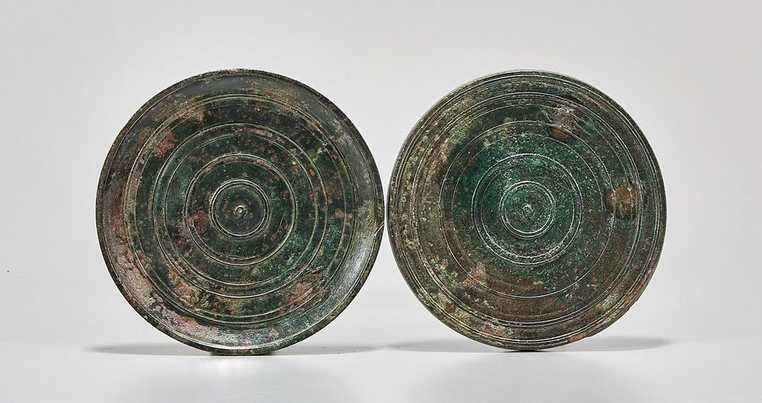 Circular Roman Bronze Hand Mirror With Cover: Circular Roman bronze hand mirror with cover, c. 1st-3rd Century AD, the exterior sides decorated with a circular pattern. Ex estate of Seward Kennedy, New York. Mr. Kennedy worked for decades as a la