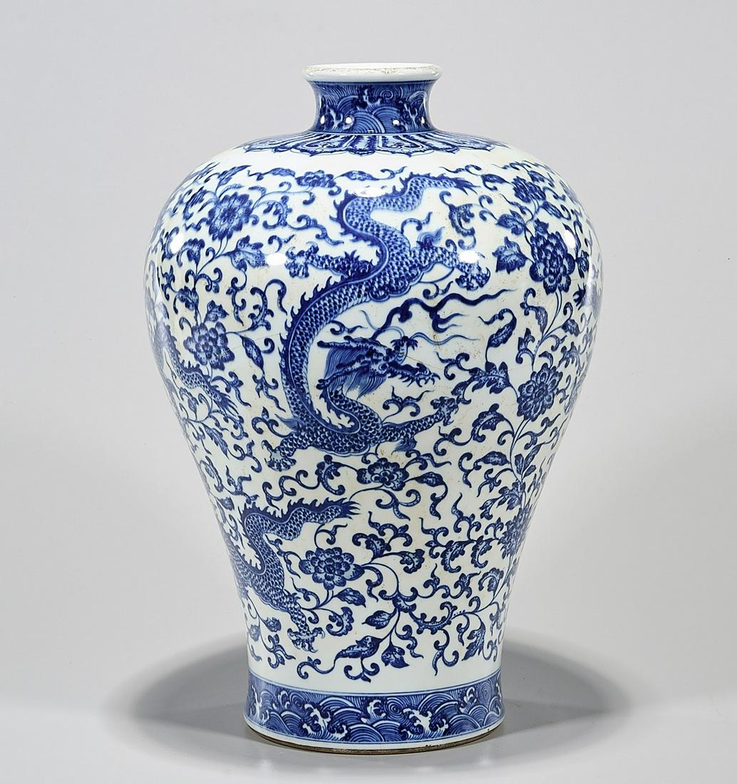 Chinese Blue and White Porcelain Vase: Chinese blue and white porcelain vase; depicting dragons chasing pearls; 14 1/2" x 10" (approx.) Condition; wear, frits, pits, minor loss