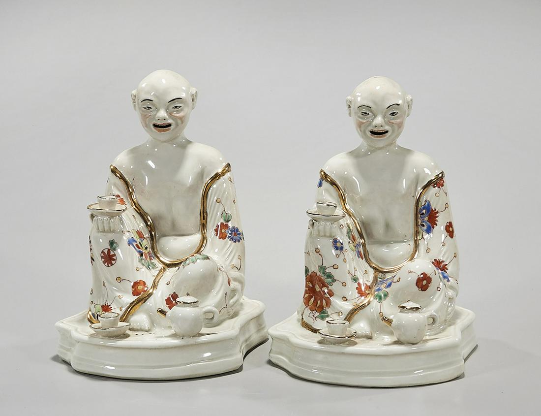 Two Chinese Porcelain Figures: Two Chinese porcelain seated figures; 8 1/2" x 6" x 6" (approx.) Condition: wear, frits, pits, minor loss
