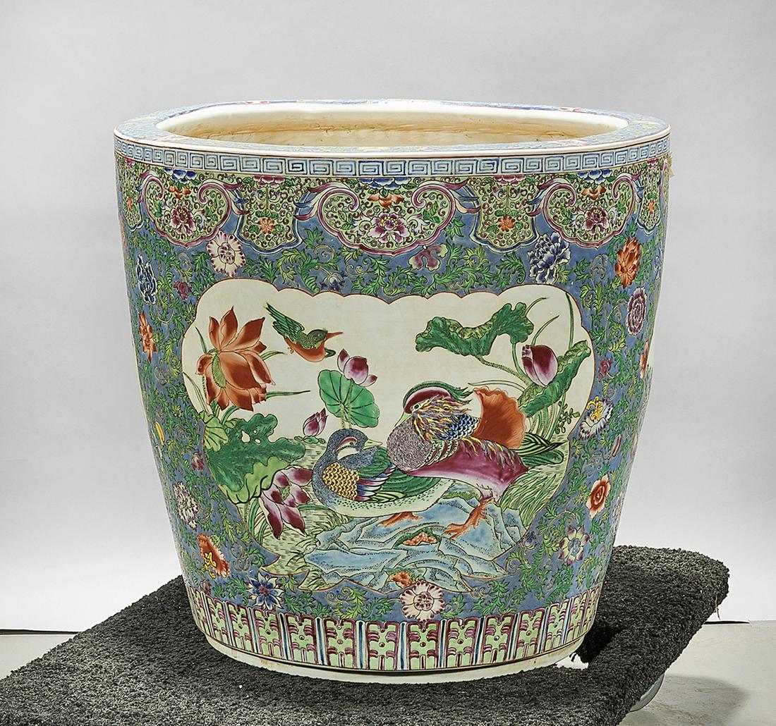 Chinese Enameled Porcelain Jardiniere: Chinese enameled porcelain jardiniere; with phoenix, ducks and other birds; flanked by flowers on green ground; 19 1/4" x 20 1/4" (approx.) Condition: wear, frits, pits, minor loss