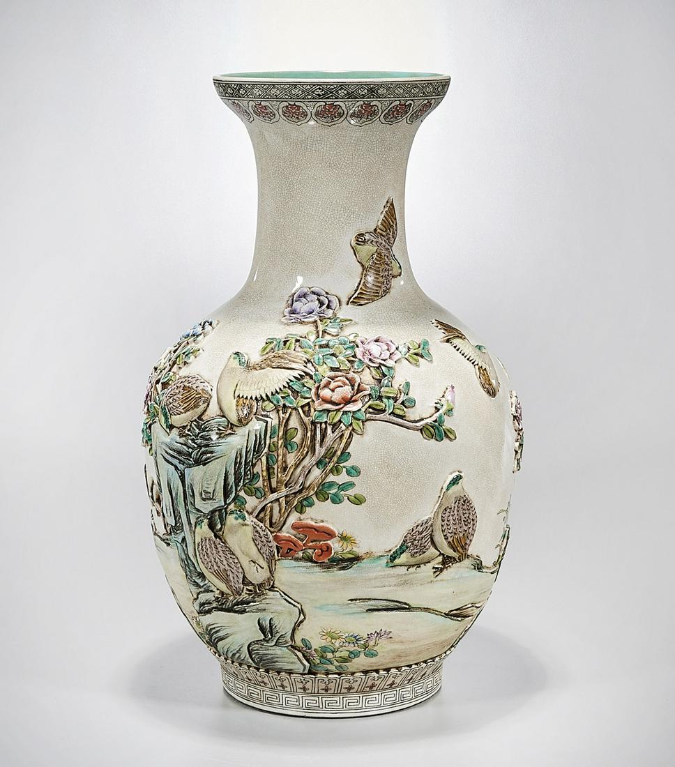Tall Chinese Enameled Porcelain Vase: Tall Chinese enameled porcelain vase; molded birds and flowers decoration; mark to base; 22" x 13" (approx.) Condition: wear, frits, pits, minor loss