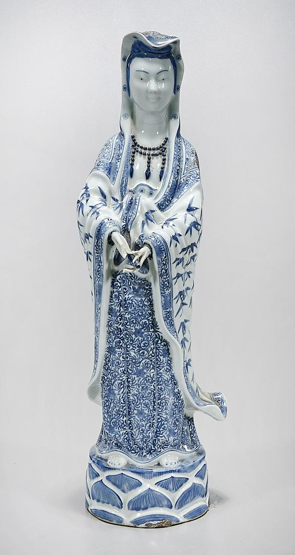 Chinese Blue and White Porcelain Guanyin: Chinese blue and white porcelain Guanyin; 17" x 5 1/2" x 4 1/2" (approx.) Condition: wear, frits, pits, minor losses