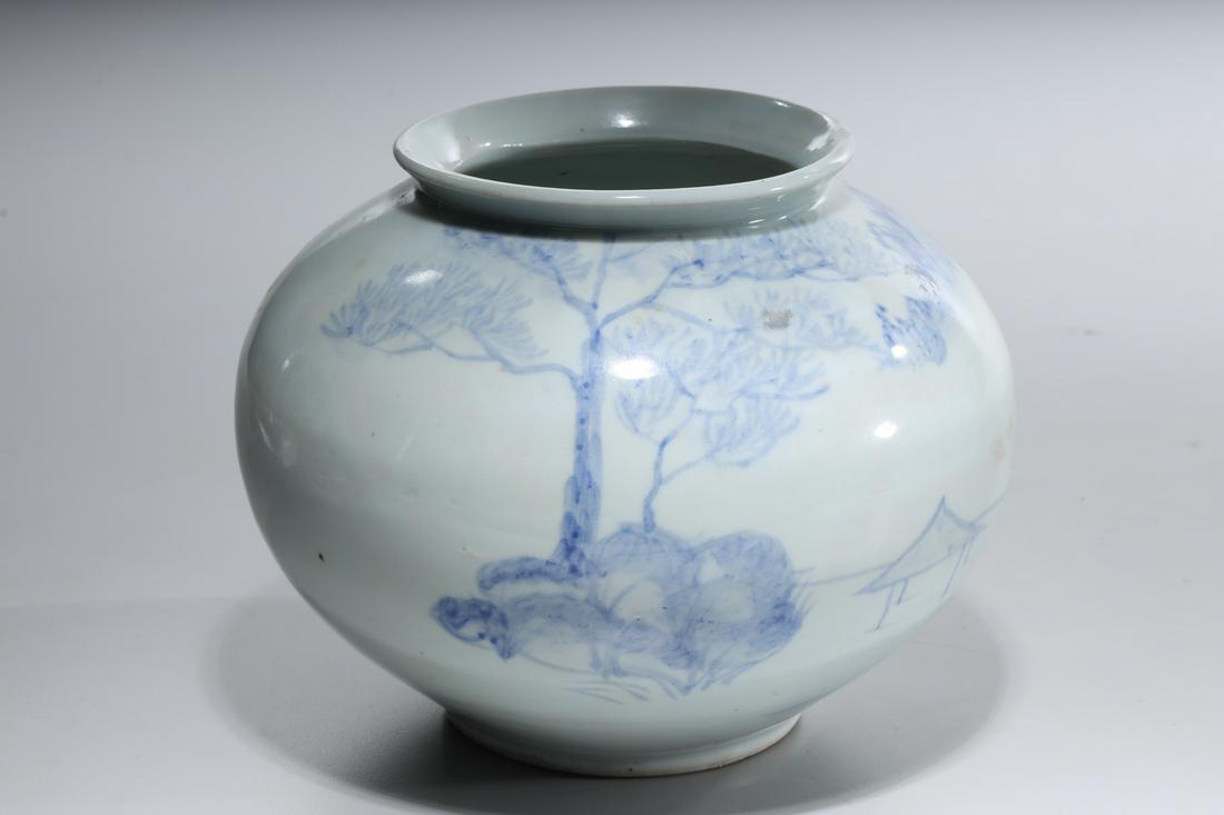 Korean Blue and White Porcelain Jar: Korean blue and white porcelain jar; depicting a fisherman in a boat surrounded by a mountainous landscape; 6 1/4" x 8" (approx.)