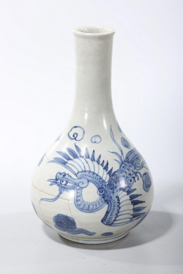 Korean Blue and White Porcelain Vase: Korean blue and white porcelain vase; depicting a phoenix with clouds; 11 1/4" x 6 1/2" (approx.) Condition: wear, heavy firing cracks, repairs, pitting