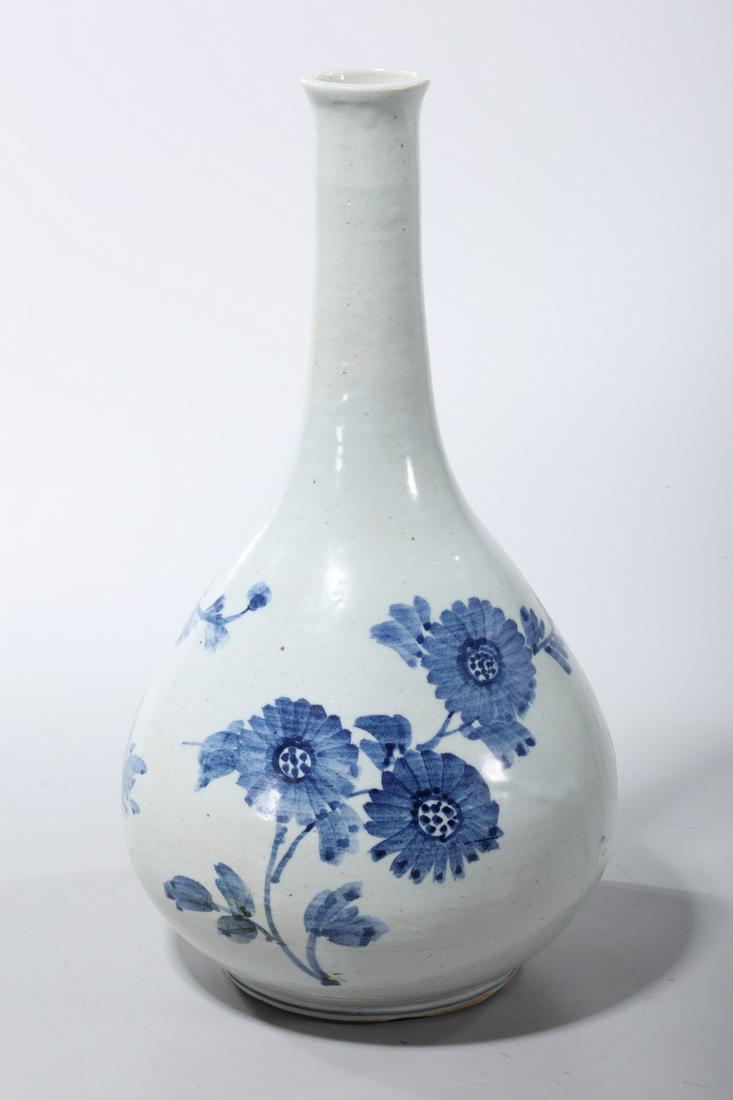 Korean Blue and White Porcelain Vase: Korean blue and white porcelain vase; with floral and butterfly decoration; 12 1/4" x 6 3/4" (approx.) Condition: firing flaws, chips to foot rim, pitting