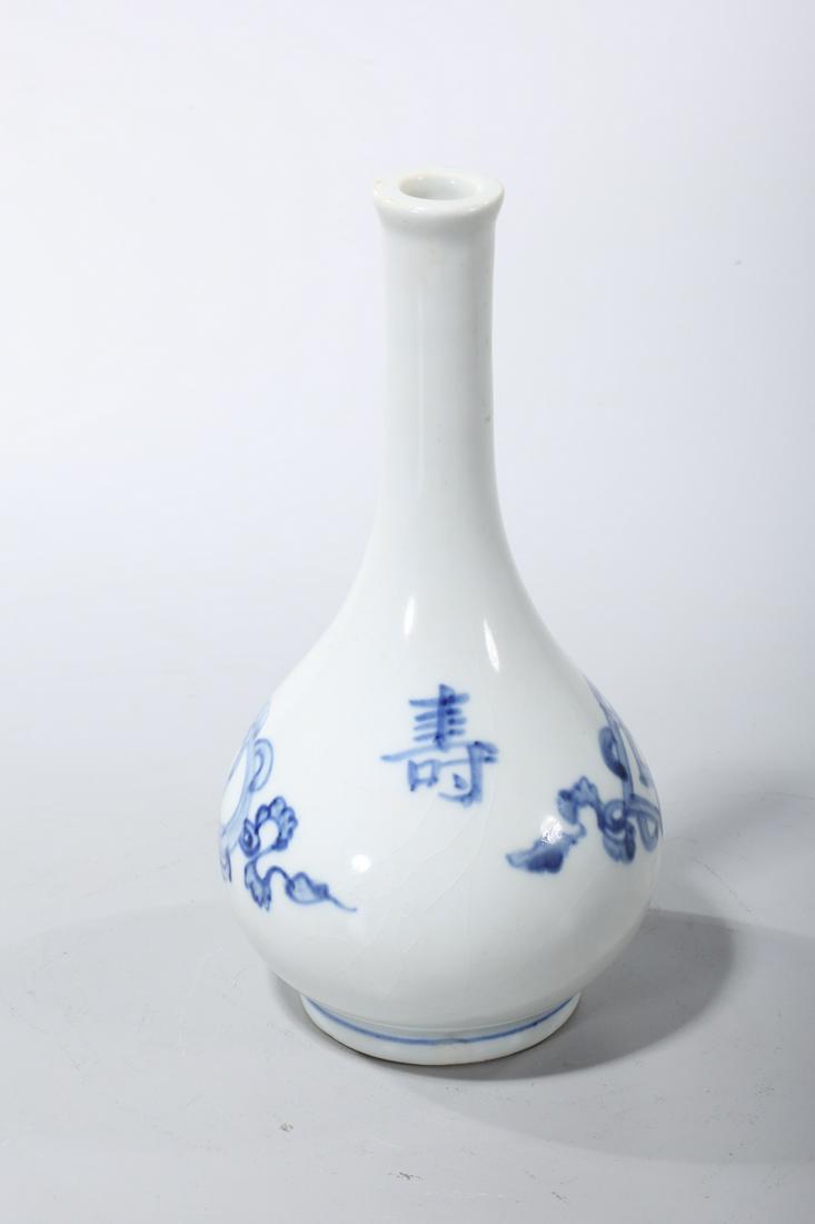 Korean Blue and White Porcelain Vase: Korean blue and white porcelain vase; with character design; 8" x 4" (approx.) Condition: pitting, firing flaws