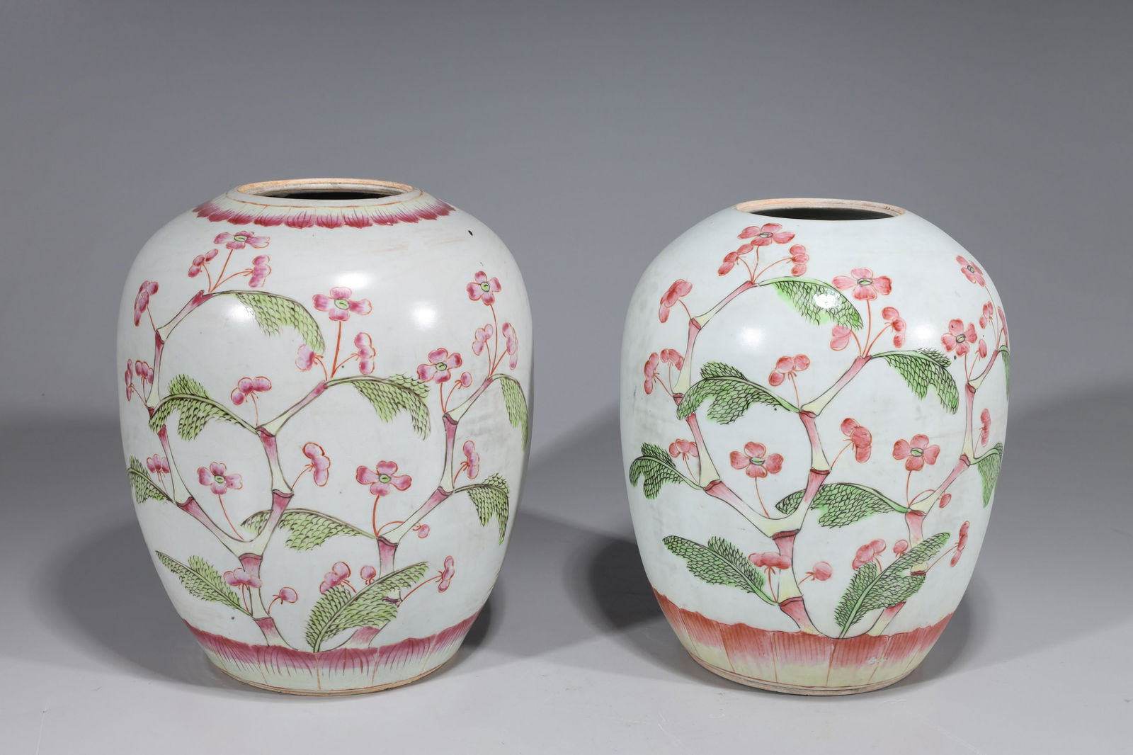 Pair Antique Chinese Enamel Porcelain Vases: Pair antique, early 20th century, famille rose enameled porcelain vases; floral designs; each missing cover, numerous chips, glaze flaws, minor losses, some losses to enamel; larger H 10 1/2" x W 8 1/