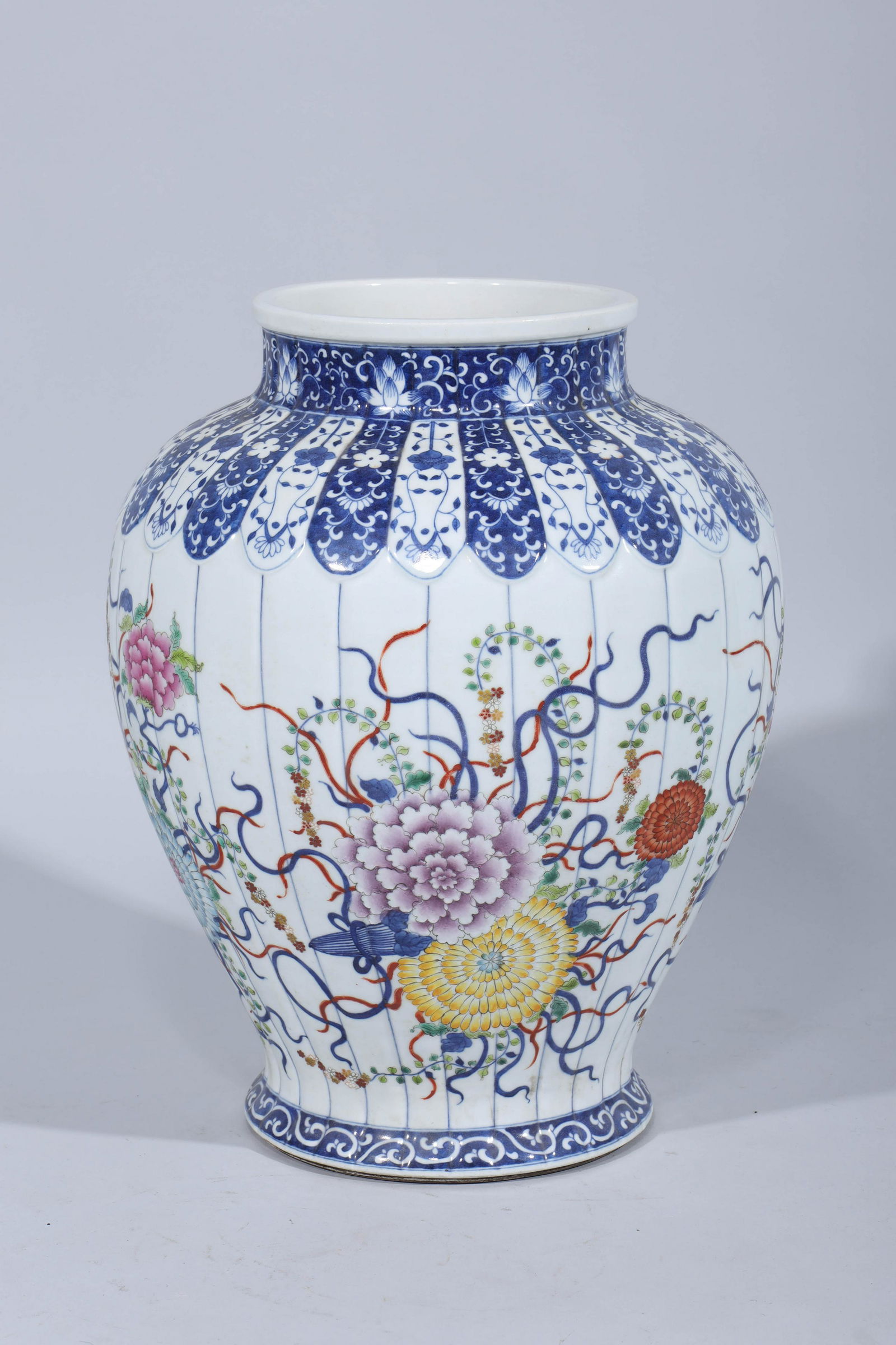 Chinese Porcelain Famille Rose Vase: Chinese porcelain famille rose and famille verte blue and white vase with floral designs; overall good condition, minor losses to enamel, minor pitting; H 16 1/4" x D 12" (approx.)