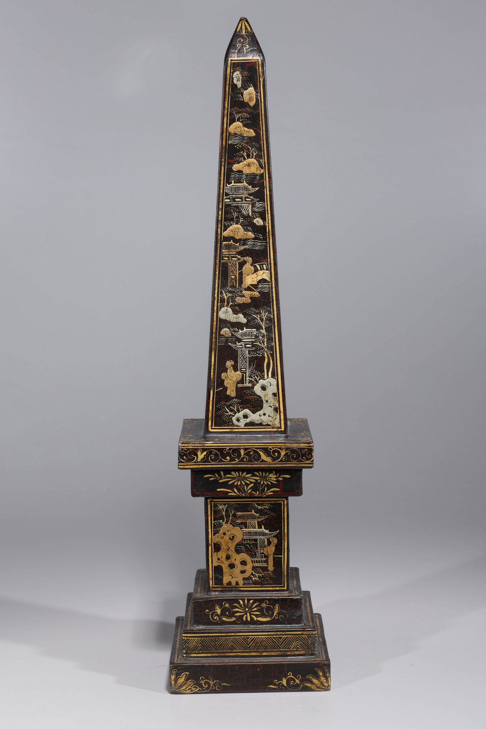Gilt & Wood Lacquer Obelisk: Tall Chinese gilt and lacquer wood obelisk, with numerous figures allover; overall good condition, minor wear; H 23 1/4" x L 5 1/2" x W 5 1/2" (approx.)