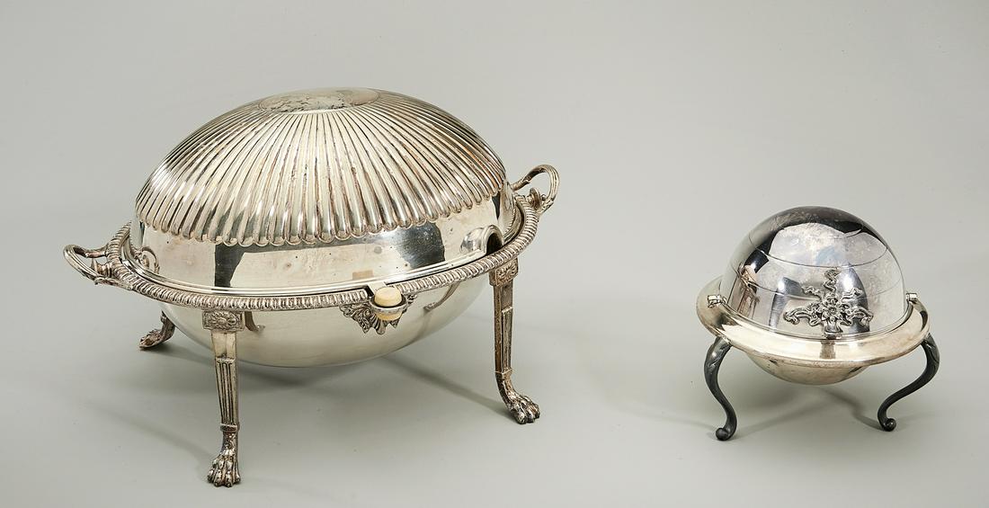 Two Silver Plate Revolving Lid Service Dishes: Two silver plate revolving lid covered dishes, including a larger egg-shaped, four-footed tureen with 96 mark; along with smaller one being tripod silver on copper dish with dome shaped lid and marks;
