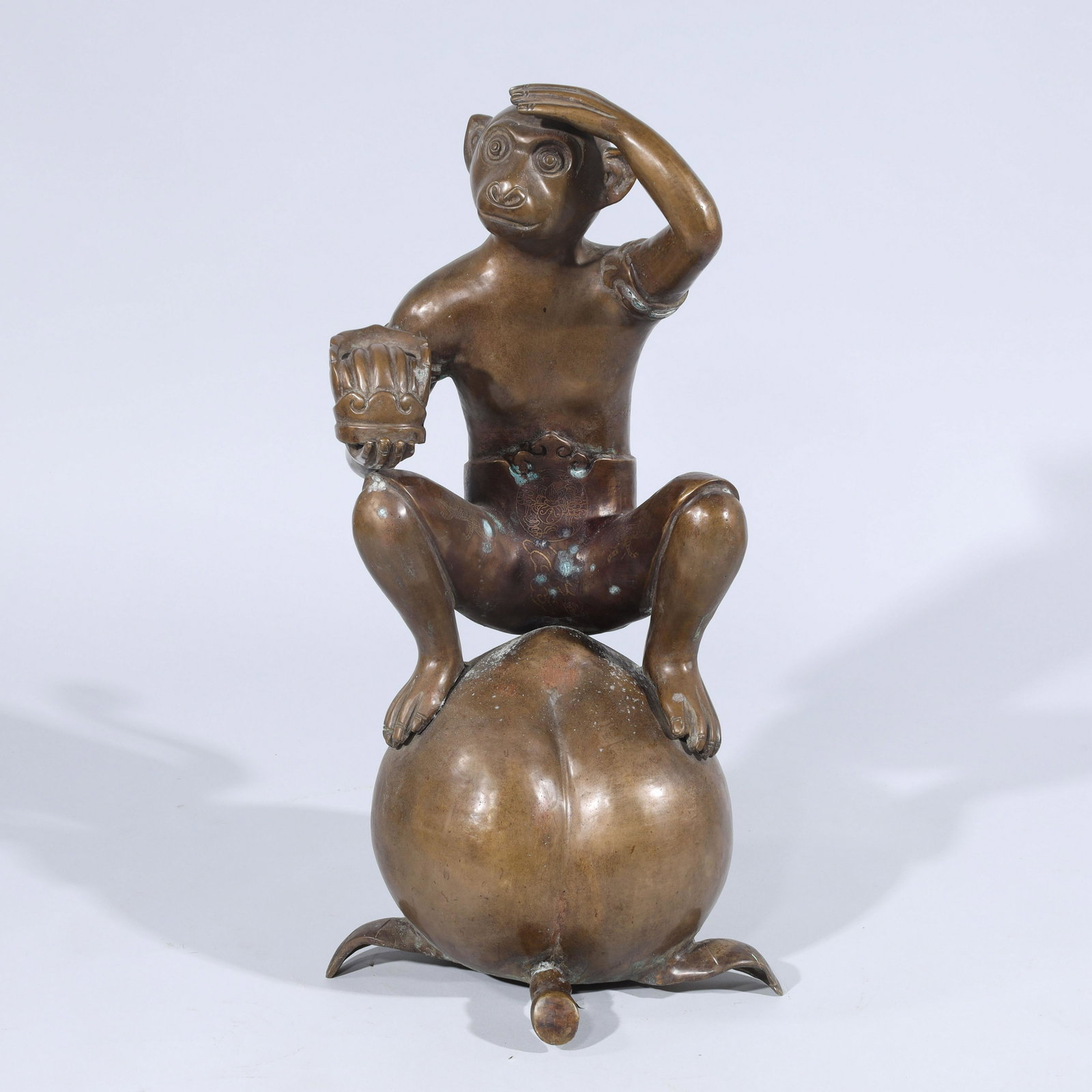 Chinese Bronze Monkey Statue: Chinese bronze statue of a monkey sitting on a peach; overall good condition, some patina, some surface scratches; H 23 1/2" x W 11 3/4" x D 14 1/4" (approx.)
