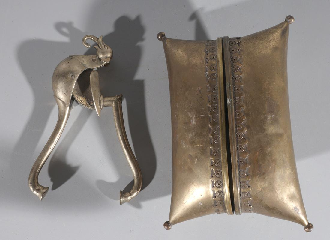 Antique Betel Nut Opener and Pillow Pouch: Antique betel nut opener and pillow pouch, bronze and brass; betel nut opener with elephant at the end, trunk turned inwards; betel nut pouch has intricate design that wraps around the center of the p