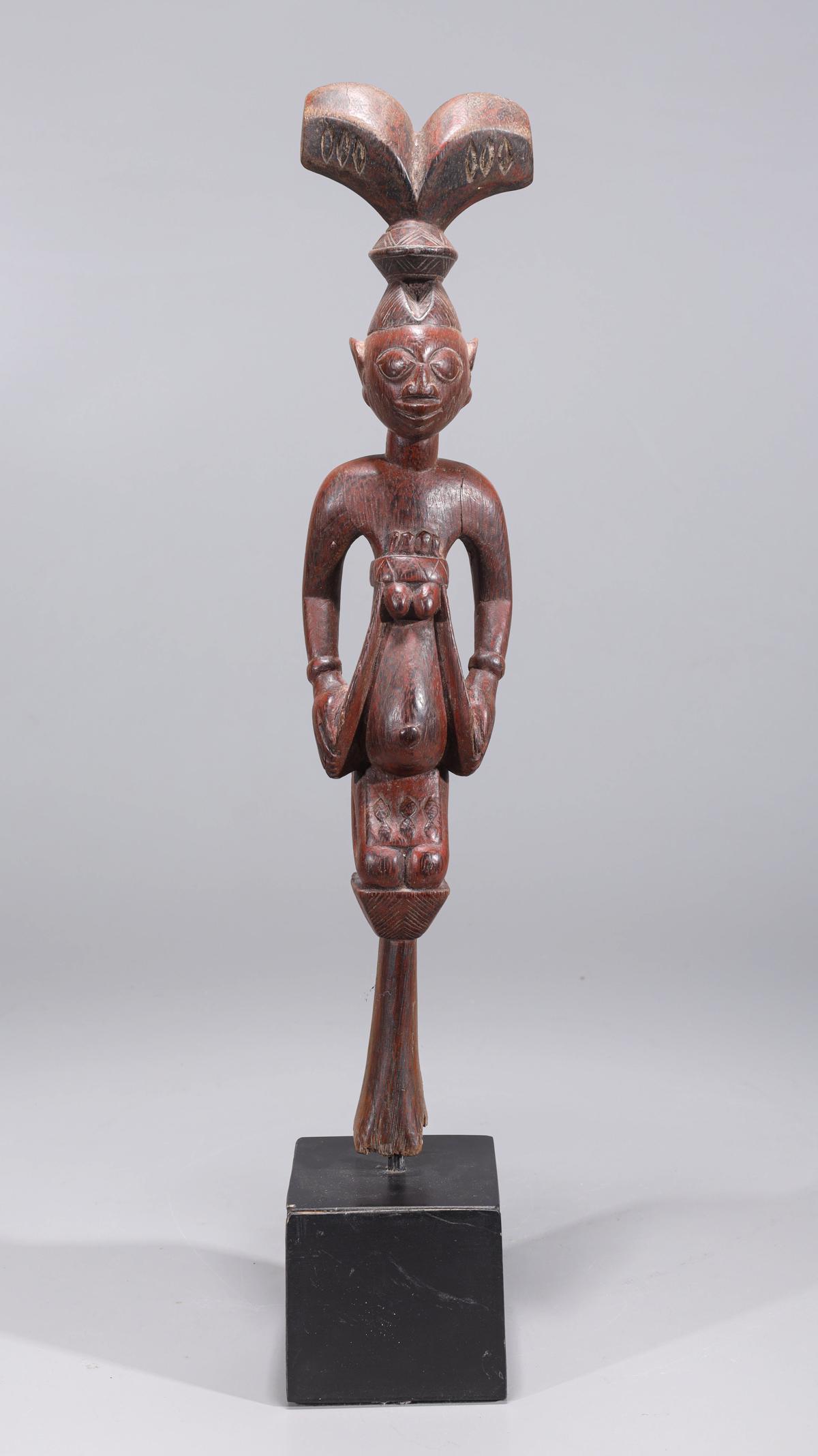 African Wooden Tribal Staff Topper: Intricately carved wood topper of an African tribal staff depicting kneeling figure, possibly with fertility connotations, with custom stand; overall good condition with minor wear; including stand H 
