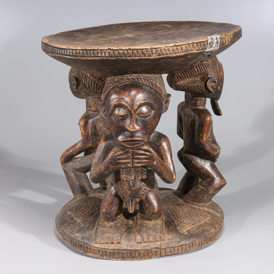 Early 19th Century, Luba Style Stool: Early 19th Century, Luba Style Stool, with 3 figures holding the top of the stool on their heads, 2 male and 1 female figure. With decorative cross hash marks in triangular shape on the bottom. Ribbed