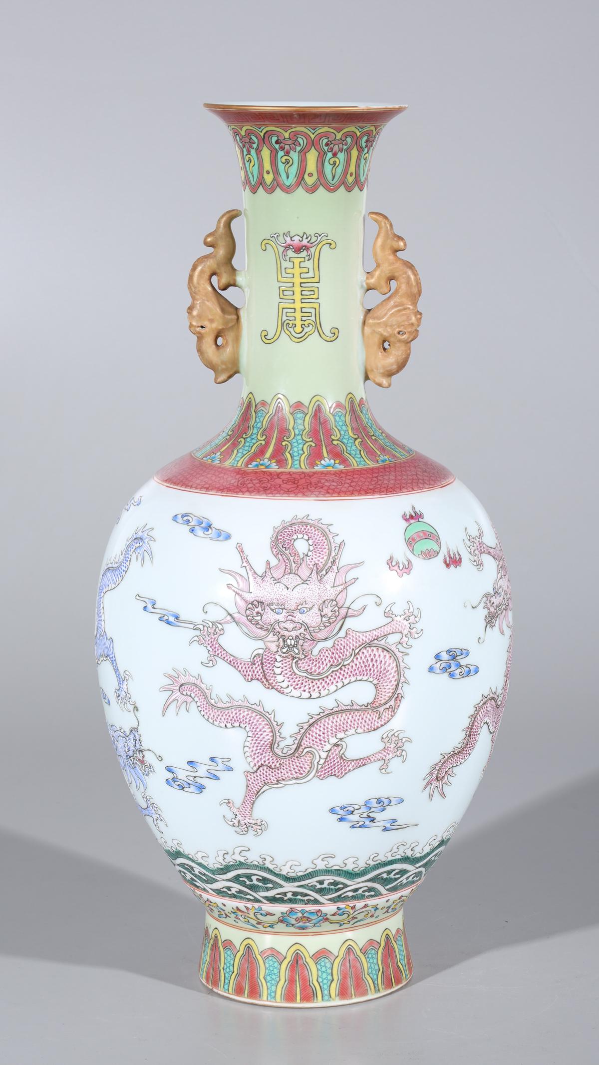Chinese Colorful Porcelain Vase - Dragons: Chinese porcelain vase with applied modeled handles featuring 5 dragons in red and blue with mark to base; condition: some loss to enamel, glaze flaws; H 18" x W 7"