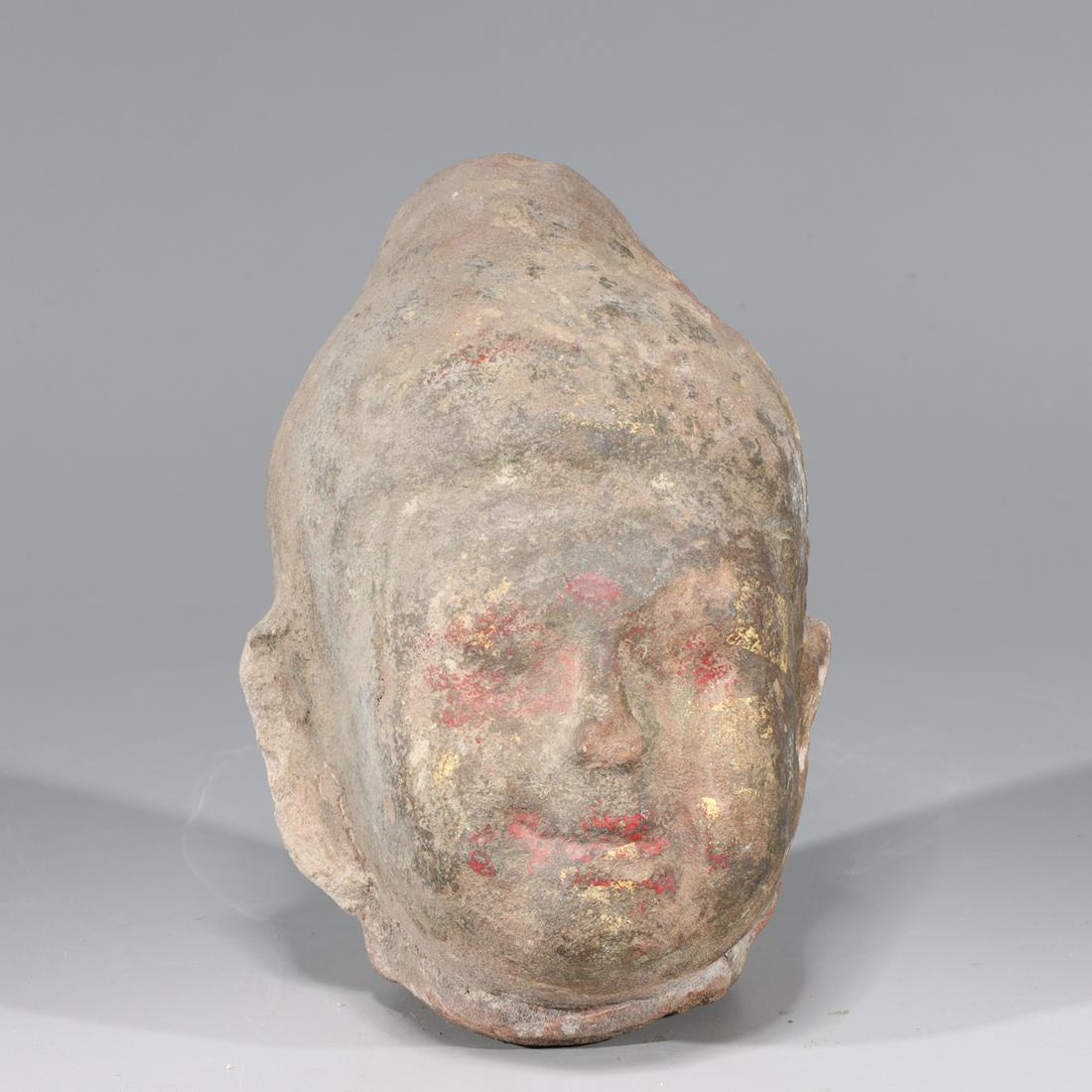 Antique Indian Carved Stone Head: Antique Indian carved stoned head with some traces of gilt and paint, 19th century or earlier; general wear commensurate with age; H 8" x W 6" x D 7" (approx.)Provenance: Collected between 1945-1960 b