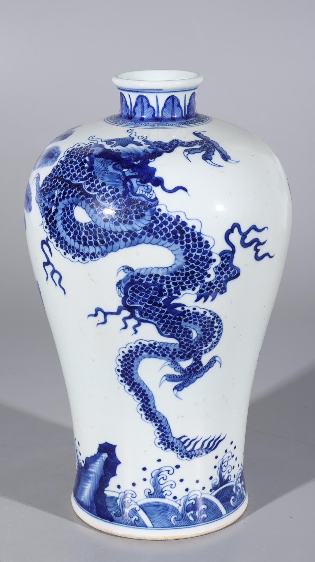 Chinese Blue & White Porcelain Meiping Vase: Chinese blue and white porcelain Meiping vase with mythical creatures to body and six-character Kangxi mark to base; some minor soiling and firing flaws to body; H 15 1/4" x 8 3/4" (approx.)