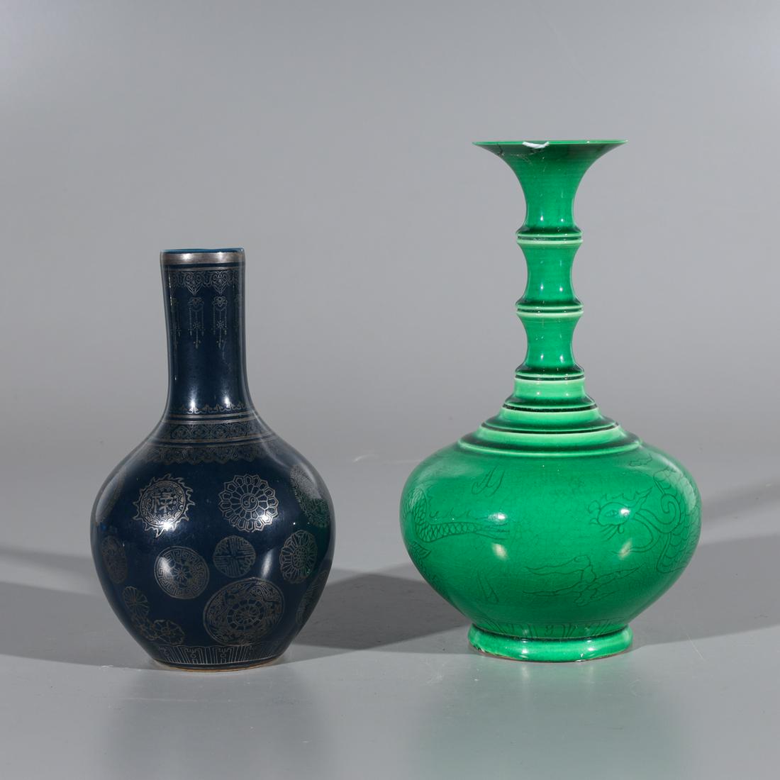 Two Chinese Glazed Porcelain Vases: Two Chinese glazed porcelain vases including one bright green vase with incised dragon designs, and one blue vase with silver designs allover, each with six-character Qianlong mark to base; some wear 