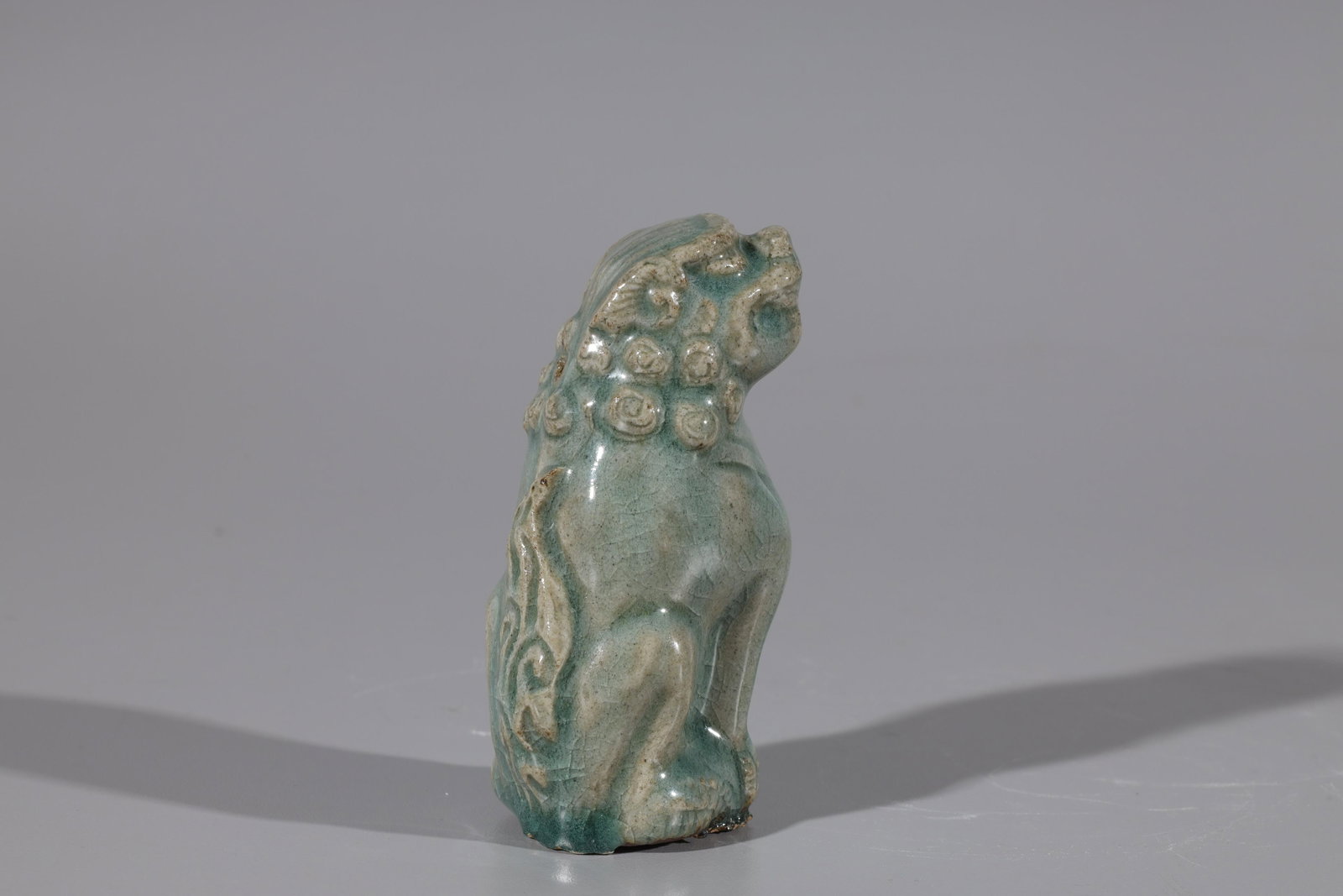 Korean Celadon Glazed Water Dropper: Korean celadon glazed lion-form water dropper; minor flaws, some glaze flaws; H 4" (approx.)