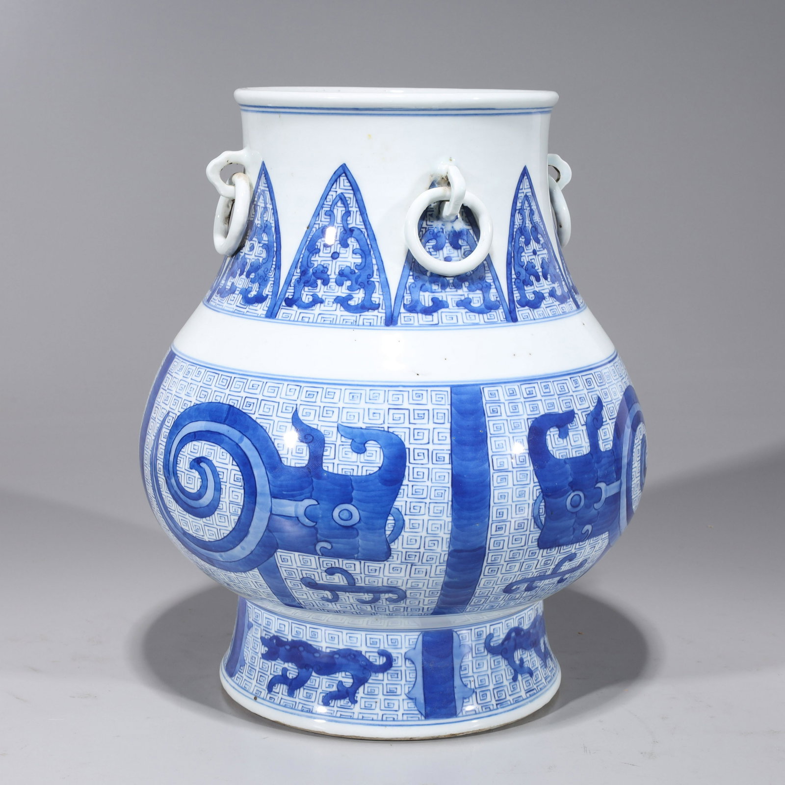 Chinese Blue & White Porcelain Vase: Chinese blue and white porcelain vase of archaistic shape with archaistic designs; overall good condition, some surface wear, minor flaws, some areas of pitting, firing flaws; H 13 1/2" x D 11 1/4" (a