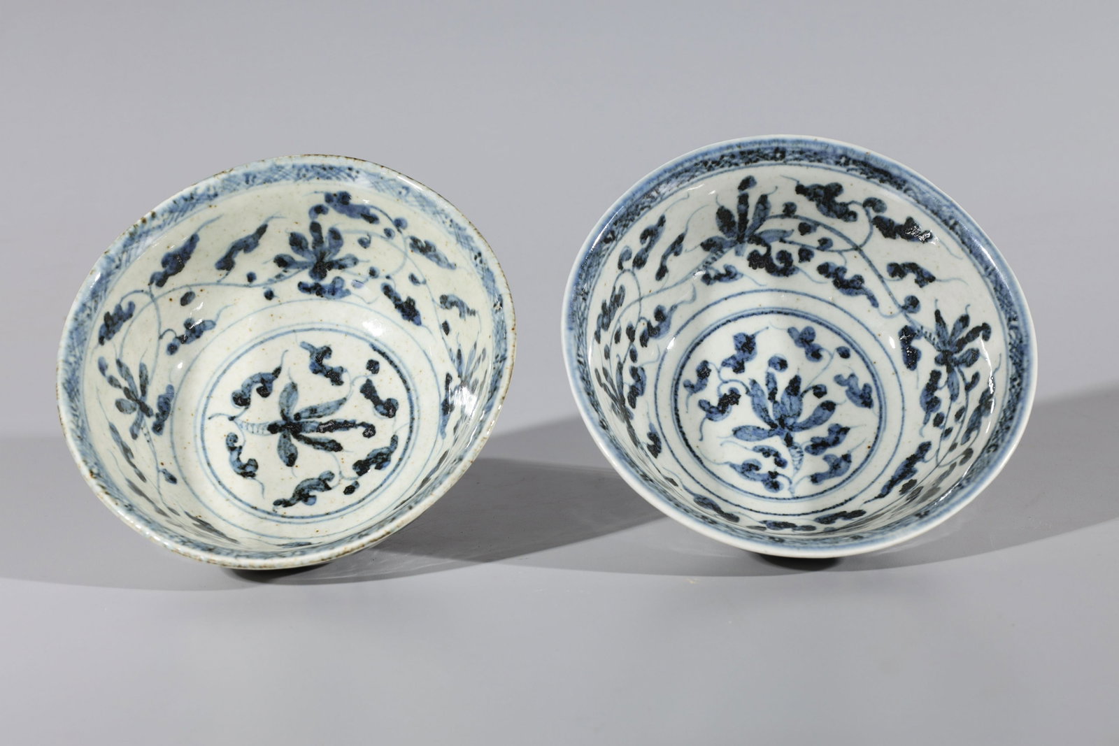 Two Chinese Ming Style Blue & White Porcelain Bowls: Two Chinese Ming style blue and white porcelain bowls, each with six-character Chenghua mark to base but later, post-1950; overall good condition with some glaze flaws, minor wear, minor surface scrat