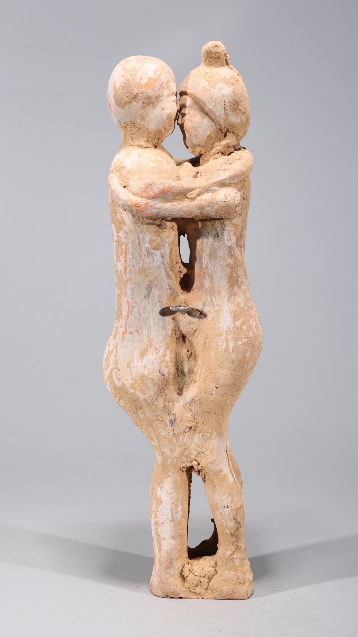 Chinese Early Style Ceramic Figures Statue: Chinese early style ceramic statue of two embracing figures; overall good condition, commensurate wear; H 23 3/4" x W 6 3/4" x D 5 1/2" (approx.)