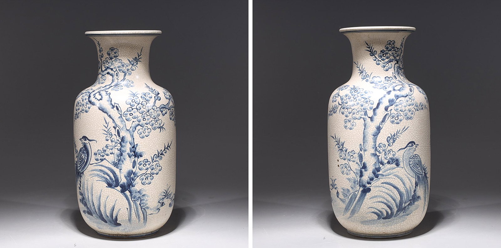 Pair of Blue & White Porcelain Vietnamese Vases: Pair of blue and white porcelain crackle glazed Vietnamese vases with birds and flowering trees to body; overall good condition; H 14 1/4" x D 7" (approx.)