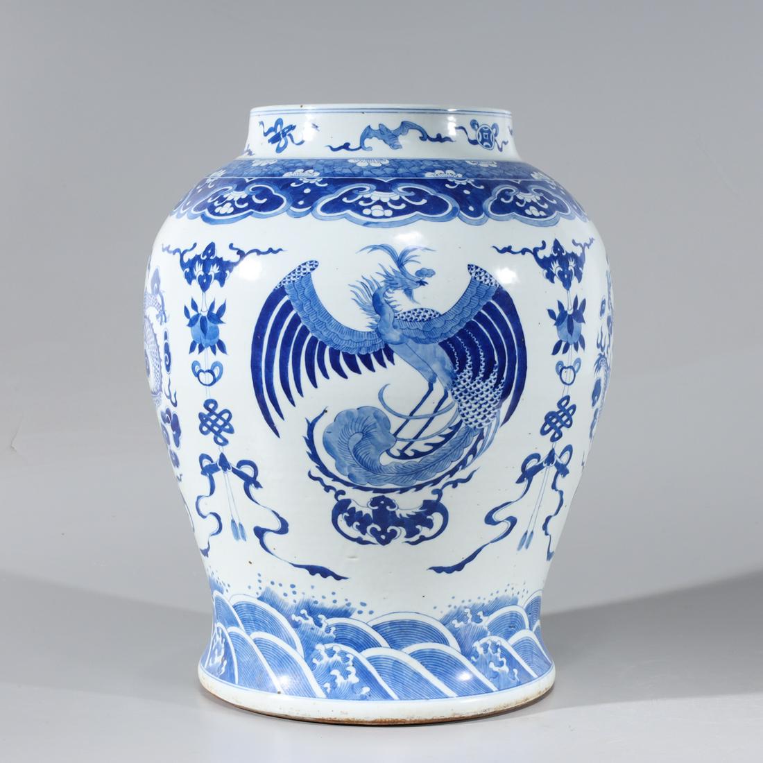 Chinese Blue & White Porcelain Dragon Vase: Large Chinese blue and white porcelain vase with dragons and phoenix birds to body; minor soiling to base and minor firing flaws; H 16 1/4" x D 13" (approx.)