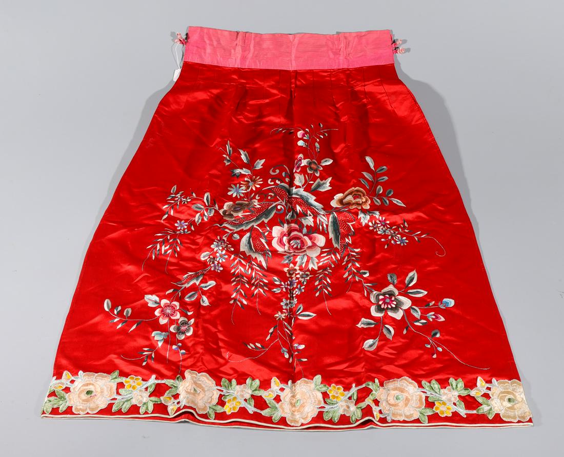 Chinese Red Silk Embroidered Skirt: Chinese red silk skirt embroidered with flowers; overall good condition; H 35" x W 27 1/2" (approx.)