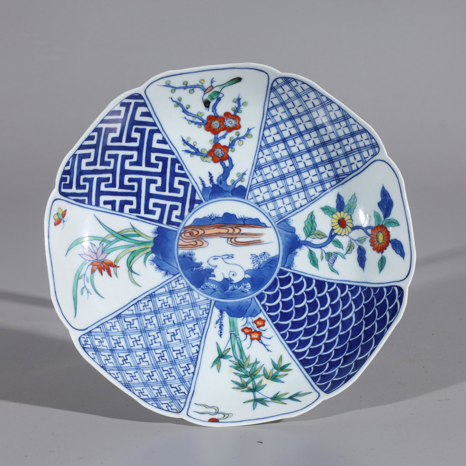 Chinese Blue & White Porcelain Plate: Chinese blue and white porcelain plate with rabbit and flower design, with six-character Kangxi mark to base; overall good condition, minor wear; H 1 1/2" x D 8 1/8" (approx.)