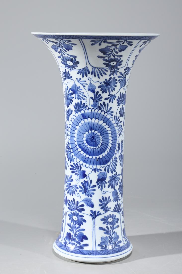 Chinese Blue & White Porcelain Beaker Vase: Chinese blue and white porcelain beaker vase with floral design to body; overall good condition; H 13 3/4" x D 7 3/4" (approx.)