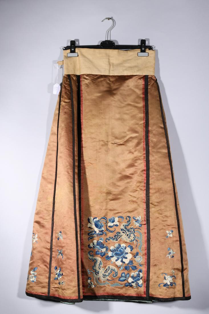 Chinese Blind Stick Skirt: Chinese blind stick skirt with floral embroidery; as-is condition, restoration work to seams; L 38" (approx.) Provenance: Private Los Angeles, CA collection