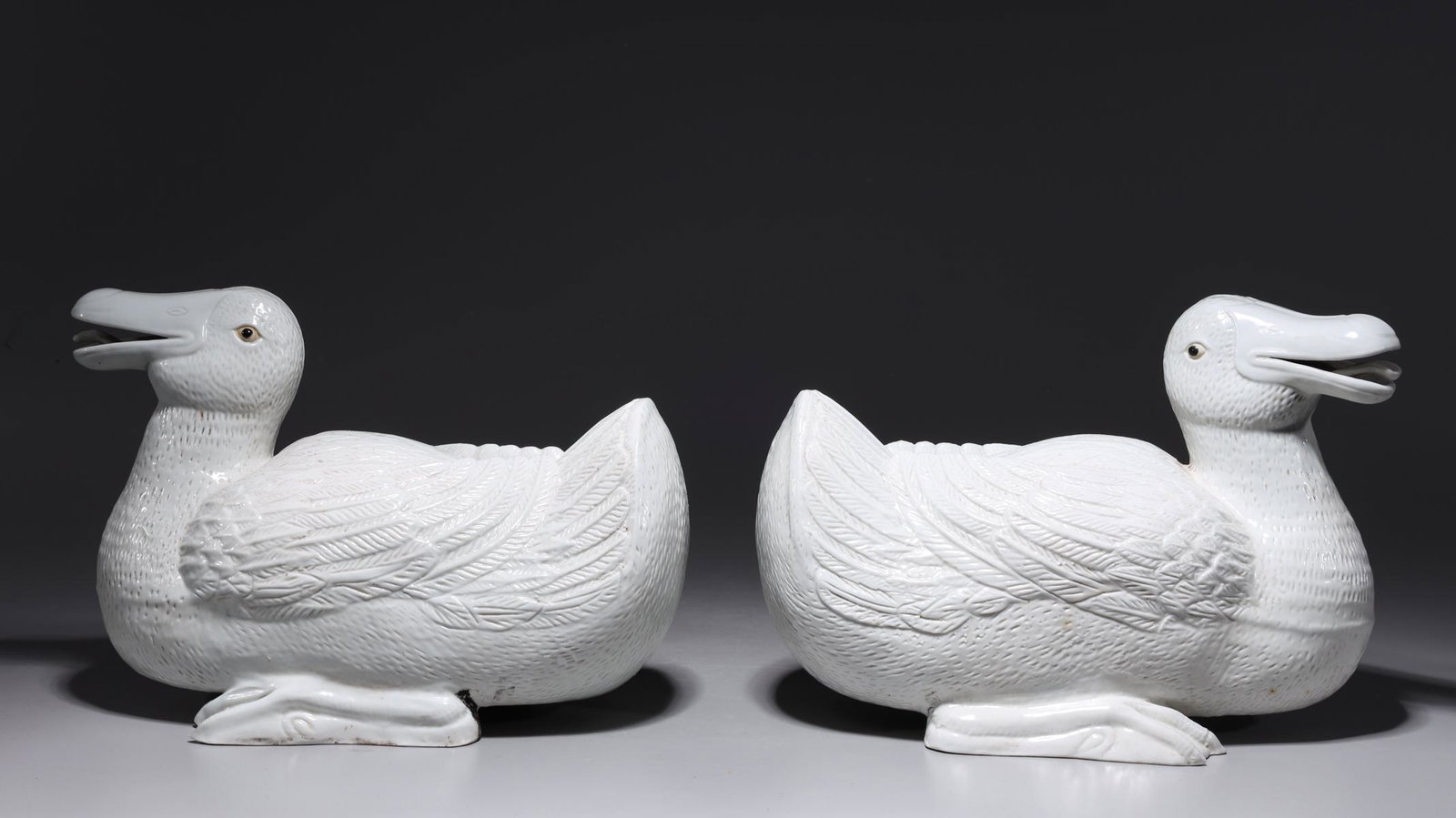 Pair of Chinese White Glazed Porcelain Ducks: Pair of Chinese white glazed porcelain ducks, each with seal mark to one foot; overall good condition, minor flaws; H 8 1/2" x L 11 1/2" x 6 1/4" (approx.)