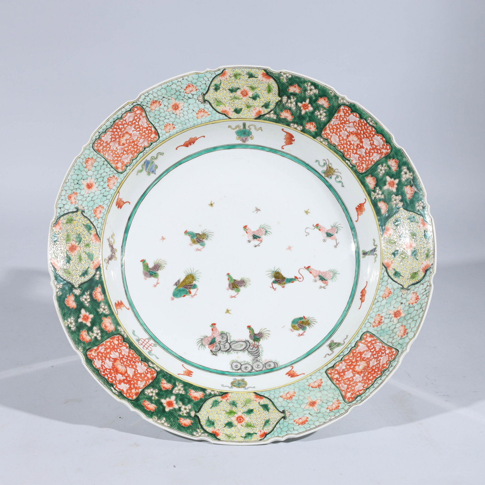 Large Famille Verte Enameled Porcelain Charger: Large famille verte enameled porcelain charger with bats and precious vessels, with six-character Qianlong mark to base; overall good condition; H 4 1/2" x D 23 1/4" (approx.)