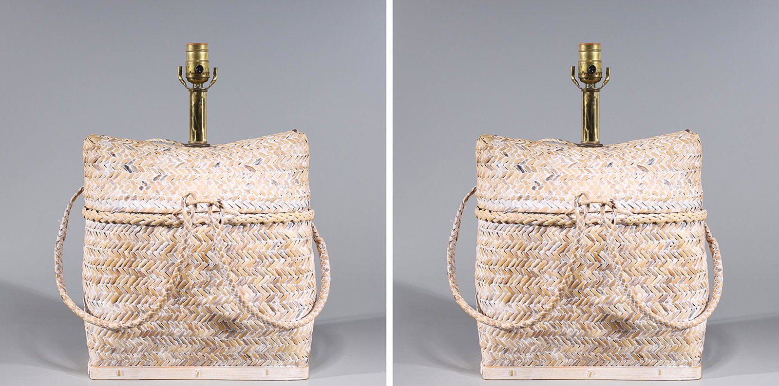 Pair of Woven Reed Satchel Lamps: Pair of woven reed satchels mounted as lamps, treated with white glaze; as-is condition, not tested for working order; each 19" x L 13 1/4" x W 6 1/4" (approx.) Provenance: Private Collection, Palos V