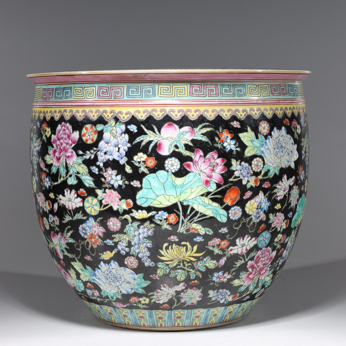 Chinese Famille Rose Enameled Porcelain Jardiniere: Chinese famille rose enameled porcelain jardiniere with allover floral designs and Qianlong mark to base; minor losses to enamel, minor soiling to rim; H 13 7/8" x D 16 1/4" (approx.)Provenance: Priva